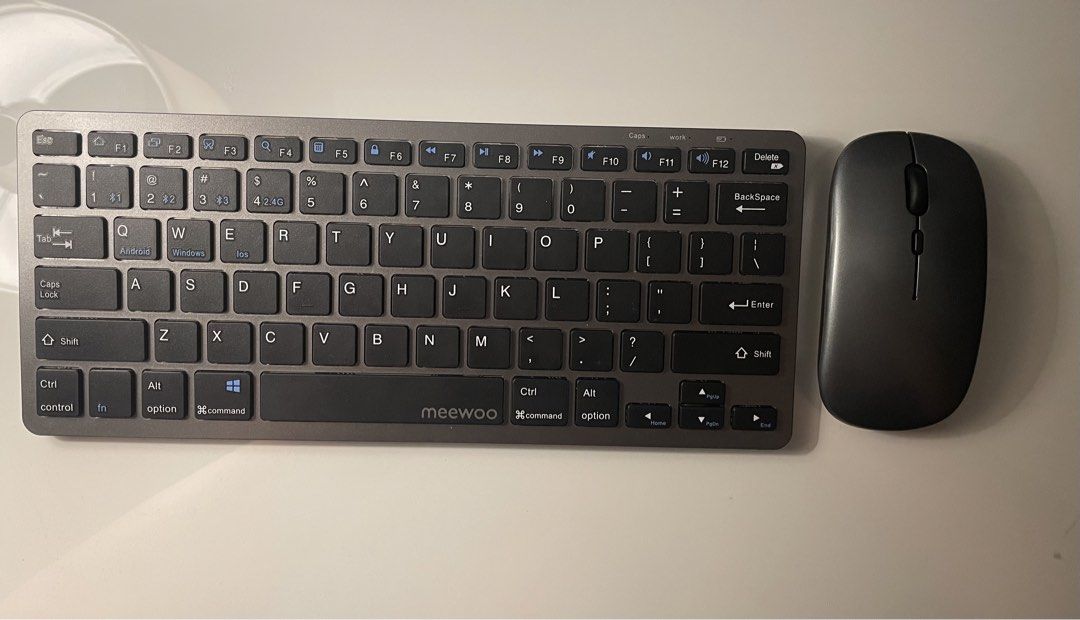 MeeWoo Wireless Keyboard and Mouse Combo - Grey (Category: Computer Keyboard) located in Manila. Submitted by uzibns (Listing ID 1464623804, Image 1). Description: Selling MeeWoo wireless keyboard with mouse Product description: 2.4GHz With bluetooth keyboard and Mouse: using three connection modes (Bluetooth 3.0, Bluetooth 5.0, 2.4GHz), Rechargeable, it can be connected to computers, mobile phones, tablets and other devices. Specification: Recha