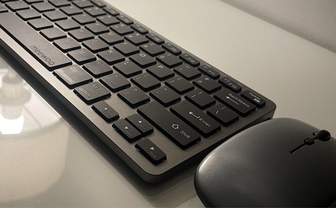 MeeWoo Wireless Keyboard and Mouse Combo - Grey (Category: Computer Keyboard) located in Manila. Submitted by uzibns (Listing ID 1464623804, Image 2). Description: Selling MeeWoo wireless keyboard with mouse Product description: 2.4GHz With bluetooth keyboard and Mouse: using three connection modes (Bluetooth 3.0, Bluetooth 5.0, 2.4GHz), Rechargeable, it can be connected to computers, mobile phones, tablets and other devices. Specification: Recha