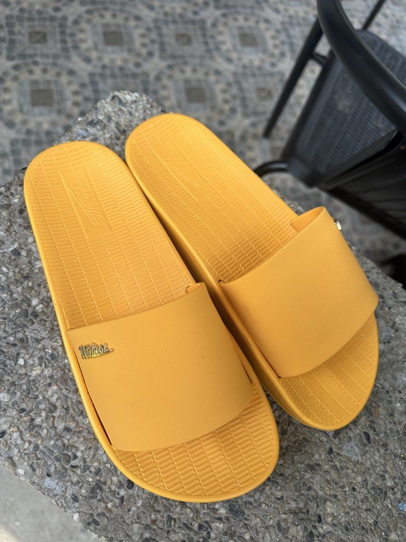 Melissa Sun Yellow Slides Sandals (Category: Flats & Sandals) located in Binangonan. Submitted by tinderella_ (Listing ID 1464597525, Image 2). Description: - Yellow Melissa Slides - Size: 5 US / 33/34 BRA / 35/36 EUR - Made in Brazil - Super comfy and bright - Vegan material - Ideal for beach or lounging.
