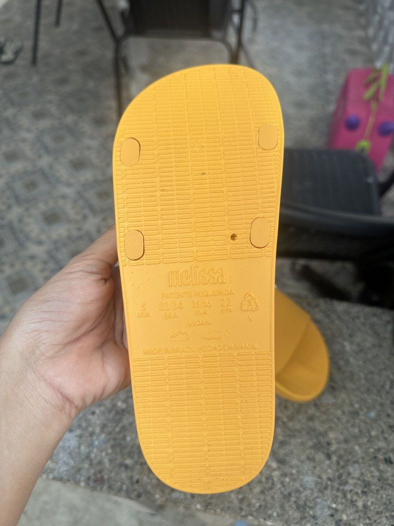 Melissa Sun Yellow Slides Sandals (Category: Flats & Sandals) located in Binangonan. Submitted by tinderella_ (Listing ID 1464597525, Image 3). Description: - Yellow Melissa Slides - Size: 5 US / 33/34 BRA / 35/36 EUR - Made in Brazil - Super comfy and bright - Vegan material - Ideal for beach or lounging.