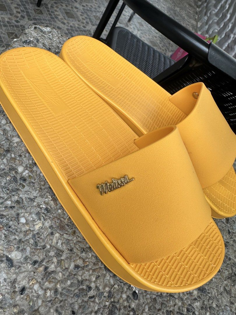 Melissa Sun Yellow Slides Sandals (Category: Flats & Sandals) located in Binangonan. Submitted by tinderella_ (Listing ID 1464597525, Image 1). Description: - Yellow Melissa Slides - Size: 5 US / 33/34 BRA / 35/36 EUR - Made in Brazil - Super comfy and bright - Vegan material - Ideal for beach or lounging.
