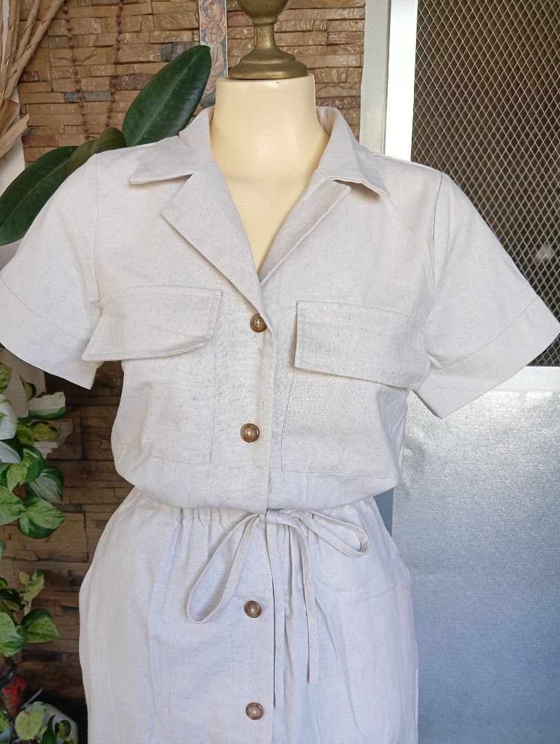 Memo Button down Dress (Category: Dresses) located in Rizal. Submitted by timeless_shop (Listing ID 1464762818, Image 3). Description: MEMO Khaki Button Down Dress _S 📏 SIZE & FIT: - Size on Tag: S - Fits Small to Medium - Length: 41 inches (Midi / Below Knee) - Waistline Fit: 28-32 (Garterized + Tie Belt) 🏷️ Details: - Brand: MEMO - 100% Original - Color: Khaki / Beige / Off-White - Style: Safari Dress / Button Down / - Design: 2 Chest Pockets