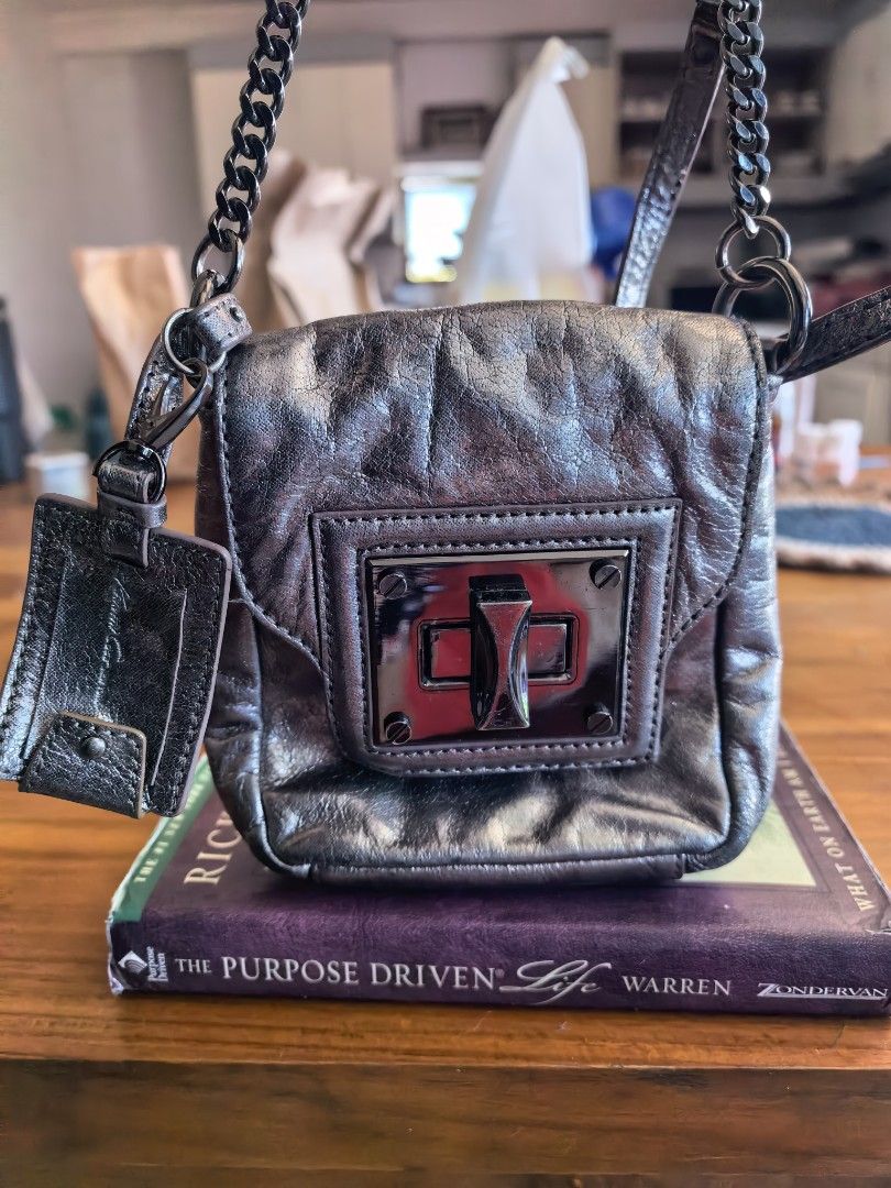 Metallic Mini Bag with Chain Strap (Category: Luxury Bags & Wallets) located in Cagayan de Oro. Submitted by tommygurl1218 (Listing ID 1464571088, Image 1). Description: - Cute metallic mini bag - Features a chain strap - Secure clasp closure - Ideal for essentials like phone and cards - Adds an edgy touch to your look - Perfect for night outs or traveling light.