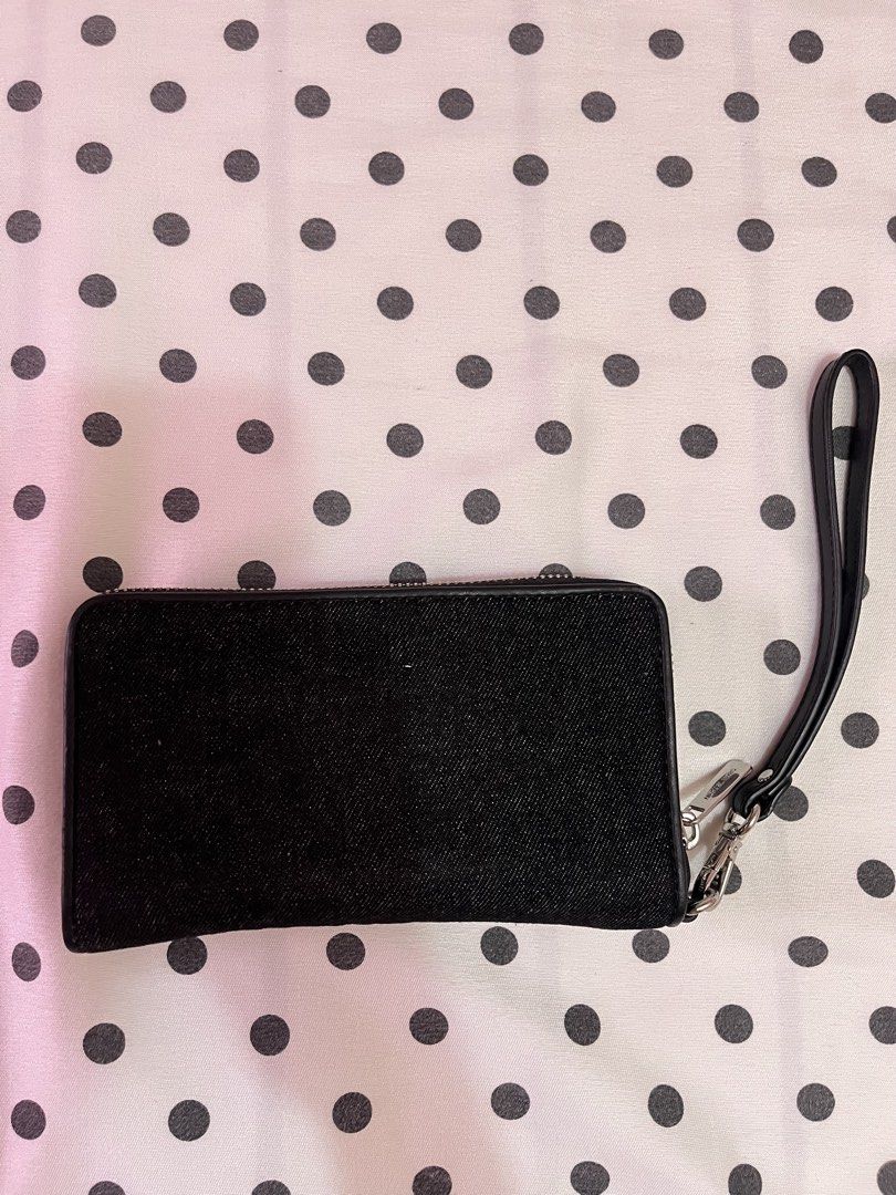 Michael Kors Black Denim Long Wallet (Category: Wallets & Card holders) located in Tarlac. Submitted by kayie__ (Listing ID 1463983319, Image 2). Description: - Authentic Michael Kors wallet - Stylish black denim material - Secure zip-around closure - Multiple card slots for organization - Dedicated space for passport and cash - Ideal for travel or everyday essentials - used the item twice only.