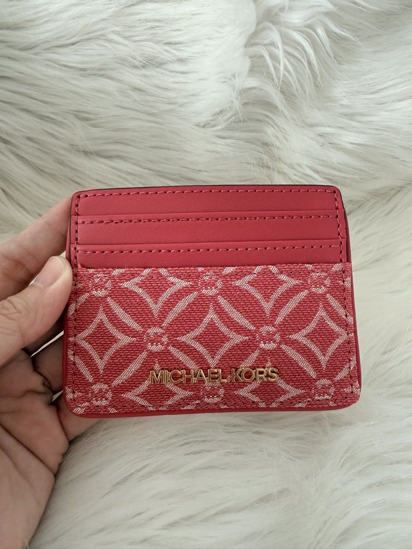 Michael Kors Card Holder Pink Monogram (Category: Luxury Bags & Wallets) located in Cainta. Submitted by mskath__ (Listing ID 1464593405, Image 1). Description: - Authentic Pink Michael Kors Card Holder - Features iconic MK monogram pattern - Multiple card slots for easy organization - Clear ID window on the back - Compact and stylish design - Perfect for keeping your essentials handy.