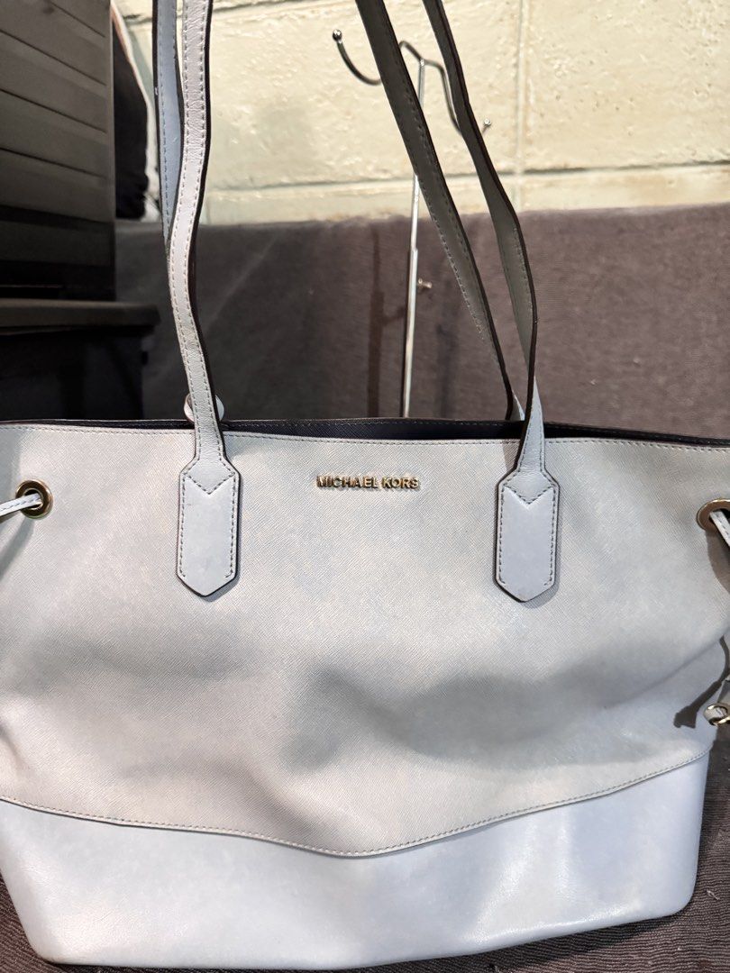 Michael Kors Light Blue Leather Tote Bag (Category: Tote Bags) located in Manila. Submitted by dearpinkcollections (Listing ID 1464679004, Image 3). Description: - Authentic Michael Kors tote bag - Color: Light Blue- Big - Material: Genuine Leather - Hardware: Gold Tone - Design: Drawstring sides - Interior: Spacious, great for everyday or travel.