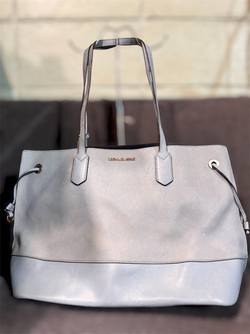 Michael Kors Light Blue Leather Tote Bag (Category: Tote Bags) located in Manila. Submitted by dearpinkcollections (Listing ID 1464679004, Image 1). Description: - Authentic Michael Kors tote bag - Color: Light Blue- Big - Material: Genuine Leather - Hardware: Gold Tone - Design: Drawstring sides - Interior: Spacious, great for everyday or travel.