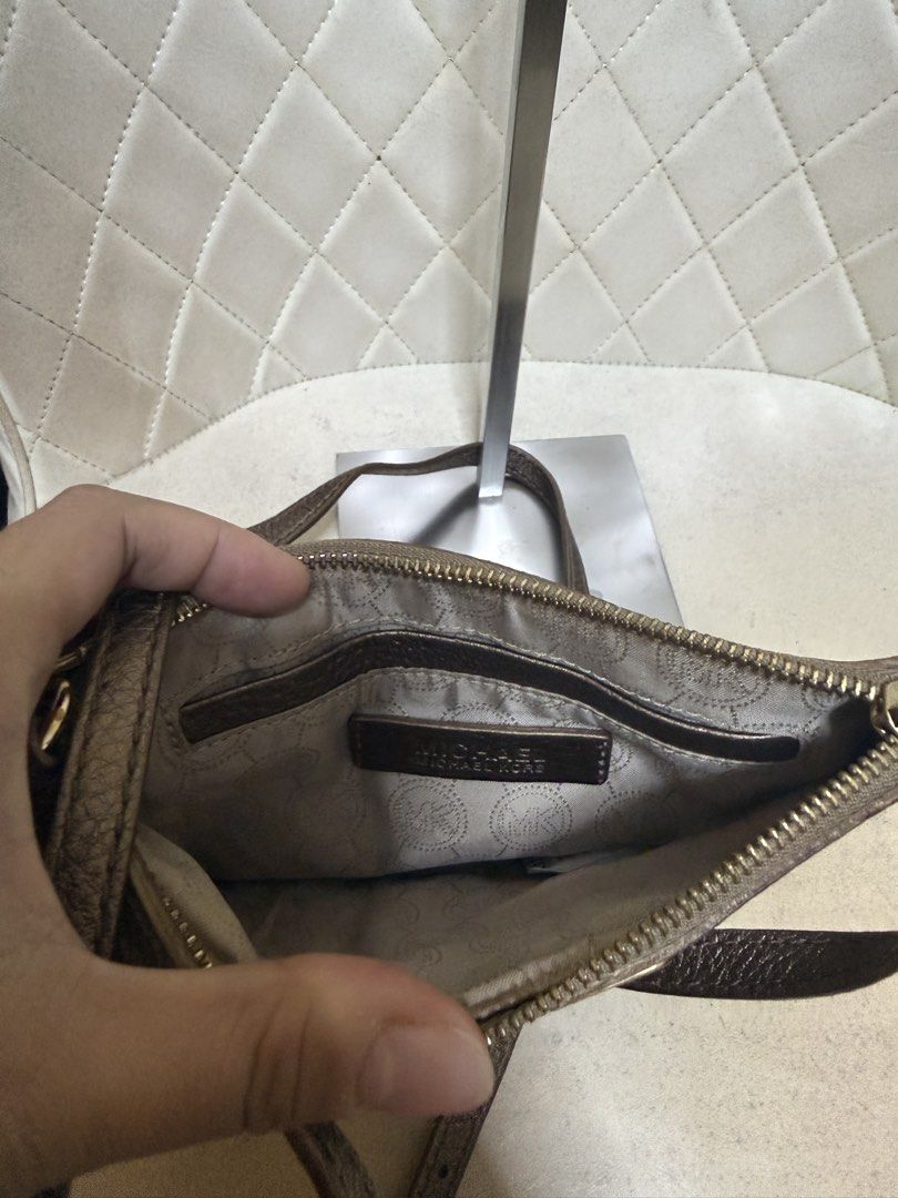 Michael Kors MK Logo Crossbody Bag with Sequins (Category: Cross-body Bags) located in Tarlac. Submitted by kayeshe (Listing ID 1464734564, Image 3). Description: - 100% Authentic - White and tan signature MK monogram print with bronze-gold sequin center stripe - Bronze metallic leather trim and adjustable strap - Secure top zip closure with gold-tone hardware - Interior features signature lining, slip pocket, and MK logo patch - Compact size, id