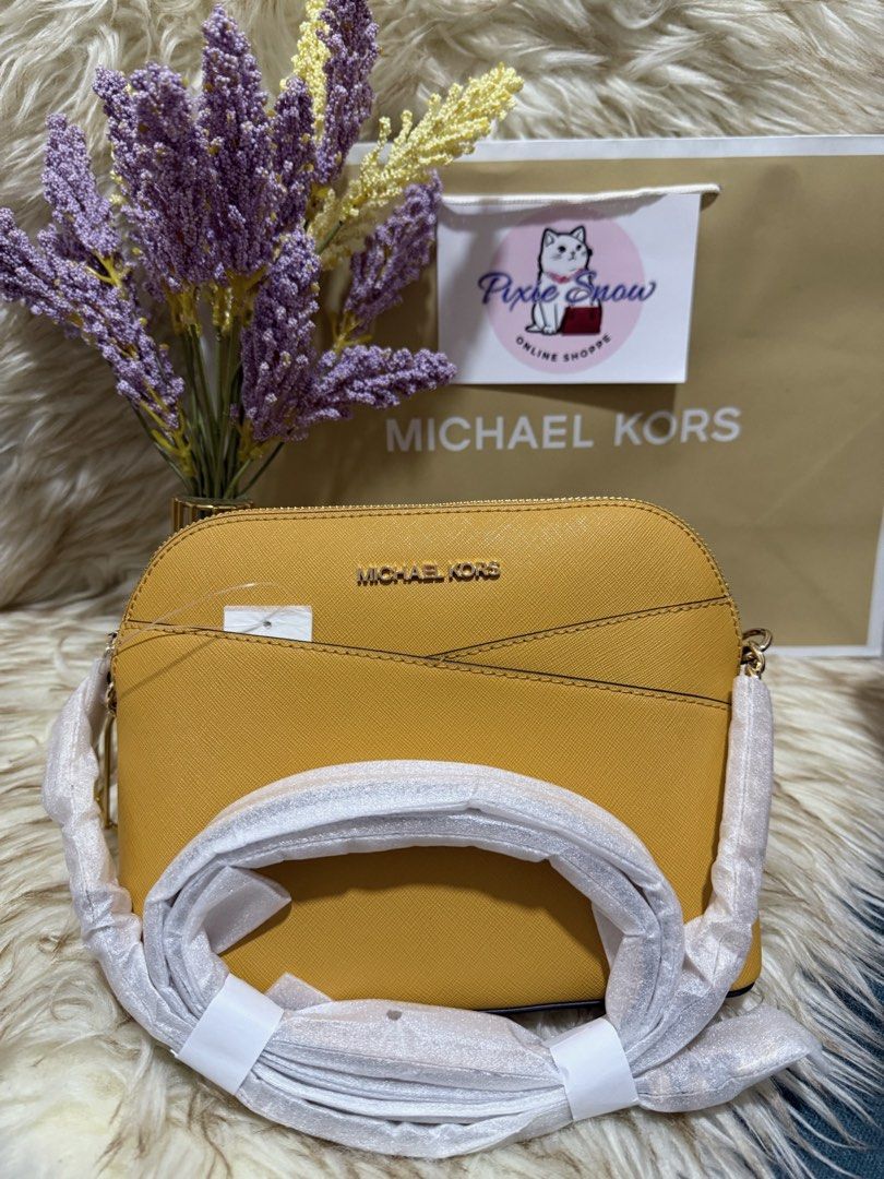 Michael Kors Yellow Crossbody Bag (Category: Cross-body Bags) located in Manila. Submitted by apolcalderon (Listing ID 1464727493, Image 1). Description: - Brand: Michael Kors - Style: Crossbody bag - Color: Bright yellow - Hardware: Gold-tone brand lettering on front - Condition: Brand new (strap wrapped in protective white paper) - 100% authentic and ready to ship.