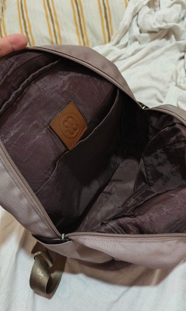 Michaela Backpack with Small Purse (Category: Backpacks) located in Marikina City. Submitted by rurunarvasa (Listing ID 1463679478, Image 2). Description: - Includes a matching zippered pouch - Convenient top handles and side pockets - Adjustable straps for a comfortable fit - Ideal for everyday use or travel.