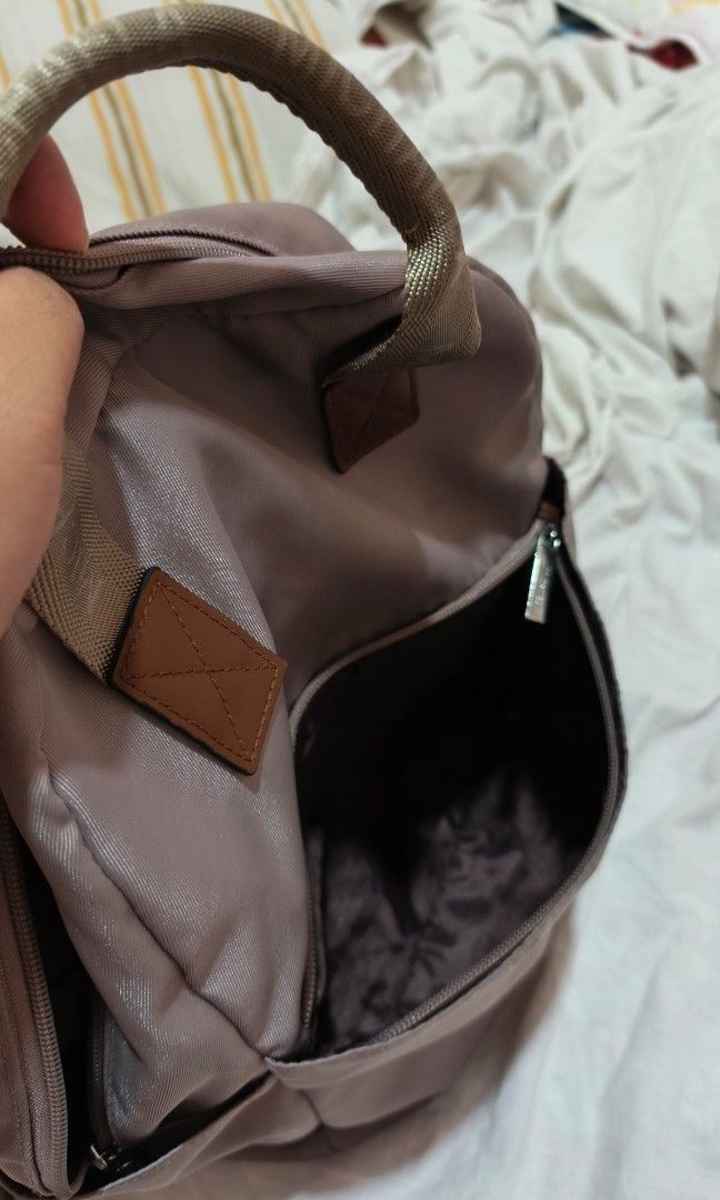 Michaela Backpack with Small Purse (Category: Backpacks) located in Marikina City. Submitted by rurunarvasa (Listing ID 1463679478, Image 3). Description: - Includes a matching zippered pouch - Convenient top handles and side pockets - Adjustable straps for a comfortable fit - Ideal for everyday use or travel.