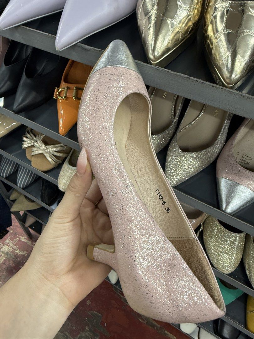 Milan & Co. Pink Glitter Heels Size 36 (Category: Heels) located in Manila. Submitted by fastlion.584bdf (Listing ID 1464737123, Image 1). Description: - Brand: Milan & Co. - Style: Kitten heel, slip-on, pointed toe cap - Color: Pink glitter with silver metallic toe - Size: 36 (stamped on sole and inner side) - Condition: Normal wear on bottom sole, upper glitter material intact - Perfect for: Parties and formal events.