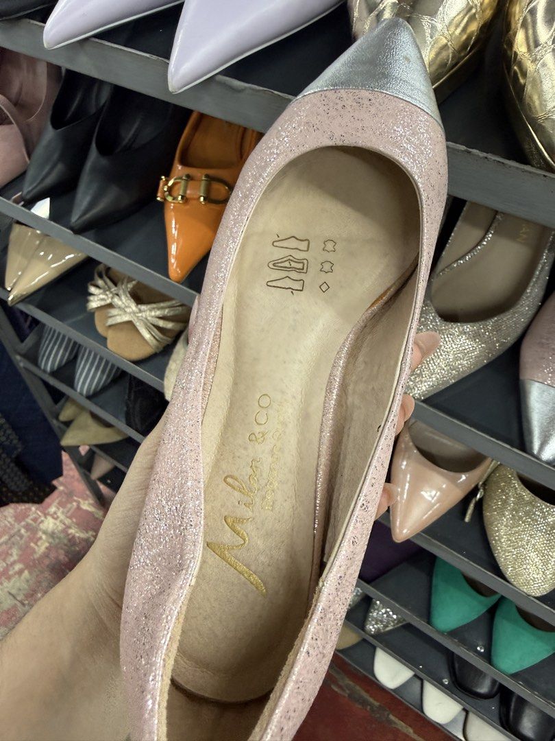Milan & Co. Pink Glitter Heels Size 36 (Category: Heels) located in Manila. Submitted by fastlion.584bdf (Listing ID 1464737123, Image 2). Description: - Brand: Milan & Co. - Style: Kitten heel, slip-on, pointed toe cap - Color: Pink glitter with silver metallic toe - Size: 36 (stamped on sole and inner side) - Condition: Normal wear on bottom sole, upper glitter material intact - Perfect for: Parties and formal events.
