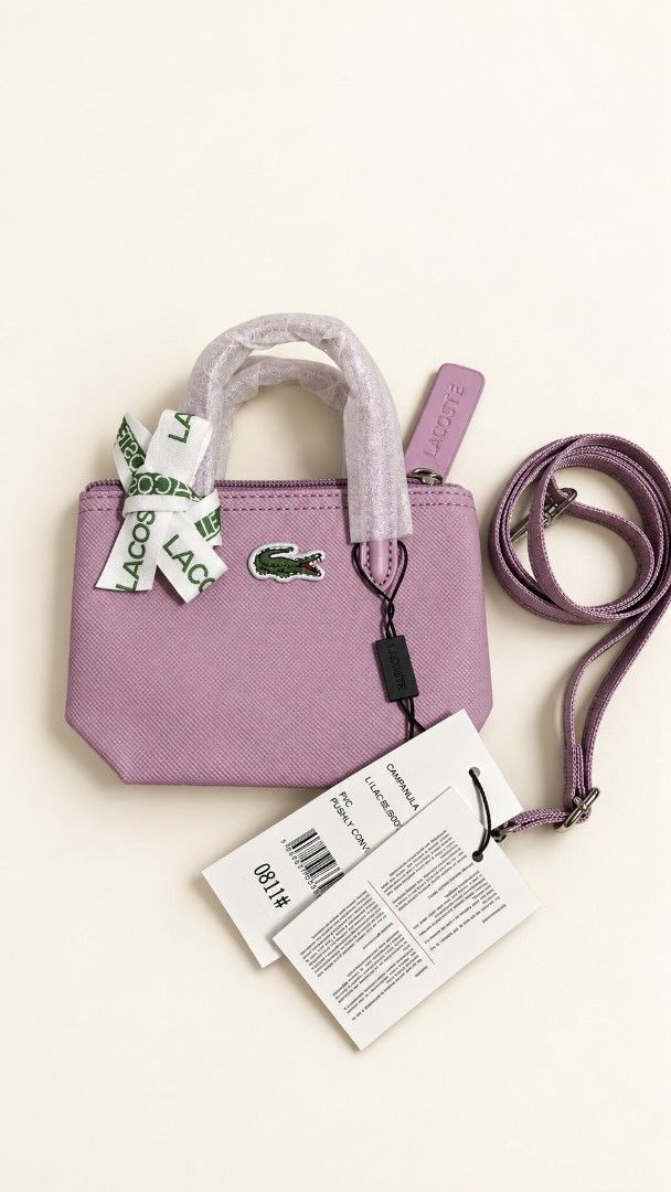 Mini Bag Lilac (Category: Purses & Pouches) located in Las Pinas. Submitted by Paninda.ph (Listing ID 1464618512, Image 1). Description: - Brand: Lacoste - Type: Mini Bag - Color: Lilac - Features: Long strap and top handles - Condition: Brand new with tags attached - Ideal for: Carrying essentials.