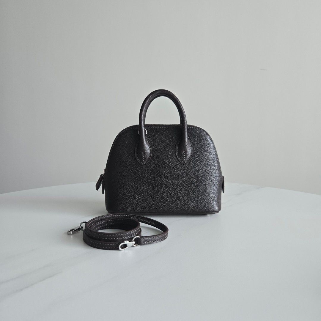 Mini Bolide (Category: Luxury Bags & Wallets) located in Paranaque City. Submitted by dclutterqueen (Listing ID 1464638883, Image 1). Description: Hermes Mini Bolide in Chocolate Brown (Rare color) 💯Genuine Leather - Chevre (goatskin) 🇯🇵Acquired preloved from Japan 👜 Measures approximately 18 x 13cm.