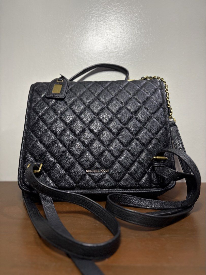 Black Quilted Backpack with Gold Hardware (Category: Backpacks) located in Manila. Submitted by journeypreloved (Listing ID 1463039361, Image 2). Description: NEGOTIABLE!!! - Stylish black quilted backpack - Features a secure gold turn-lock closure on the front flap - Includes a top handle and adjustable straps for comfortable carrying -May cabinet/storage smell.