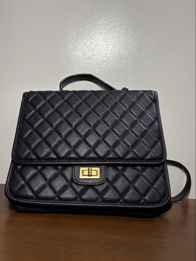 Black Quilted Backpack with Gold Hardware (Category: Backpacks) located in Manila. Submitted by journeypreloved (Listing ID 1463039361, Image 1). Description: NEGOTIABLE!!! - Stylish black quilted backpack - Features a secure gold turn-lock closure on the front flap - Includes a top handle and adjustable straps for comfortable carrying -May cabinet/storage smell.