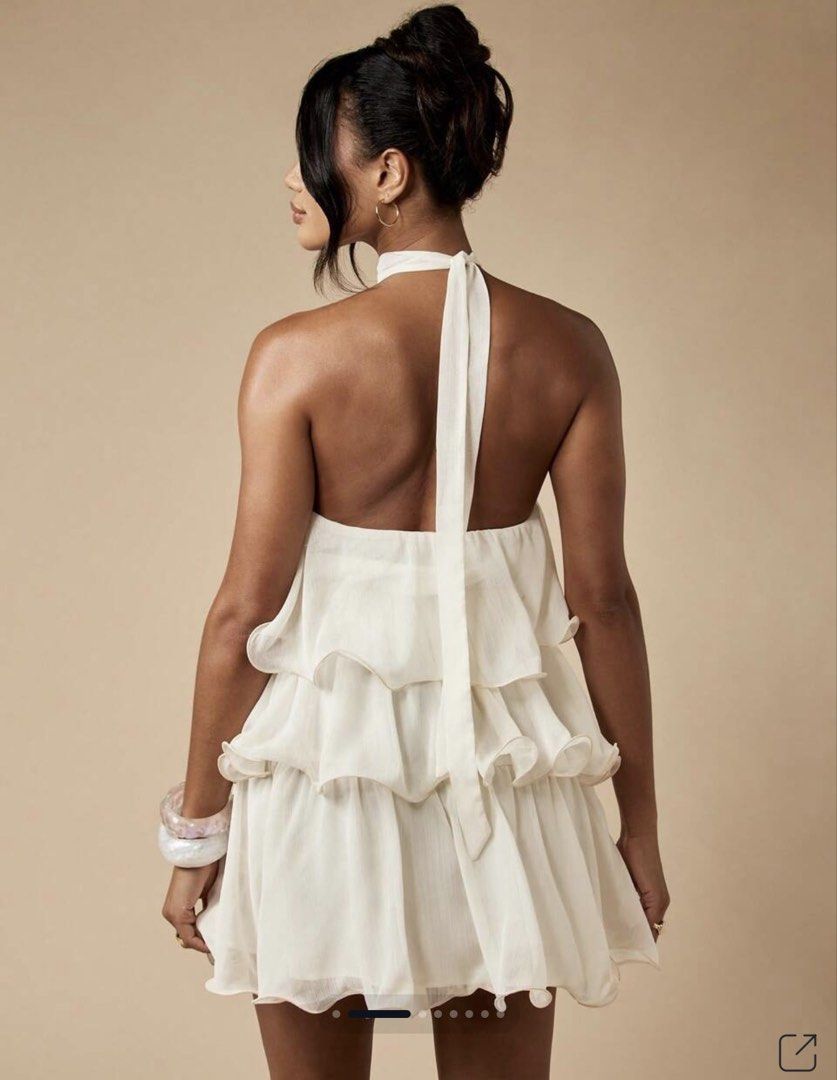 MISSGUIDED One Shoulder Tiered Ruffle Mini Dress (Category: Dresses) located in Tuguegarao City. Submitted by notacoolkid (Listing ID 1464700411, Image 3). Description: - Brand: Missguided - Color: White - Condition: Brand new with tags (never worn) - Design: One-shoulder with halter neck tie and tiered ruffle skirt - Fabric: Lightweight and flowy - Shipping: Ready to ship immediately.