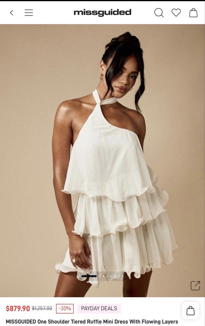 MISSGUIDED One Shoulder Tiered Ruffle Mini Dress (Category: Dresses) located in Tuguegarao City. Submitted by notacoolkid (Listing ID 1464700411, Image 1). Description: - Brand: Missguided - Color: White - Condition: Brand new with tags (never worn) - Design: One-shoulder with halter neck tie and tiered ruffle skirt - Fabric: Lightweight and flowy - Shipping: Ready to ship immediately.