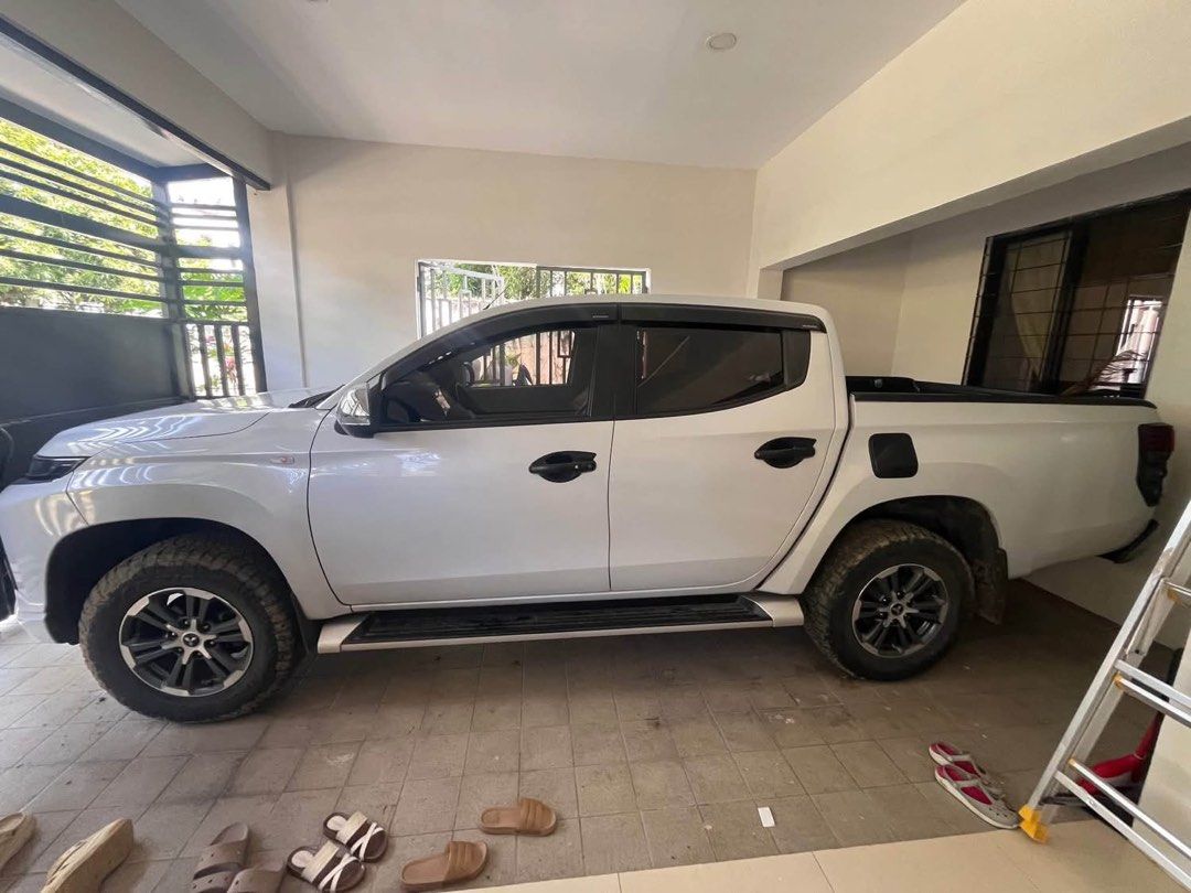 Mitsubishi Strada 2019 GLX Plus Auto (Category: Used Cars) located in Manila. Submitted by ejstrada2019 (Listing ID 1464586493, Image 3). Description: FOR SALE – 2019 Mitsubishi Strada GLX Plus 2.4 Automatic Price: ₱700,000 First Owner 2019 Mitsubishi Strada GLX Plus 2.4 AT in White Diamond with 110,000 KM mileage. Powered by a 2.4L MIVEC Turbo Diesel engine producing 181 PS and 430 Nm of torque, paired with a 6-speed automatic transmission. Casa