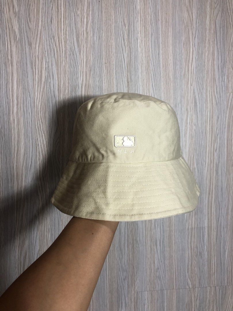 MLB Bucket Hat - Cream - Medium to Large (Category: Caps & Hats) located in Montevista. Submitted by rdthriftshub (Listing ID 1464655802, Image 2). Description: - Cream colored MLB bucket hat - Classic MLB logo embroidered on the front - Size 57 (fits Medium to Large) - Ideal for sunny days - Versatile and easy to style with any outfit.