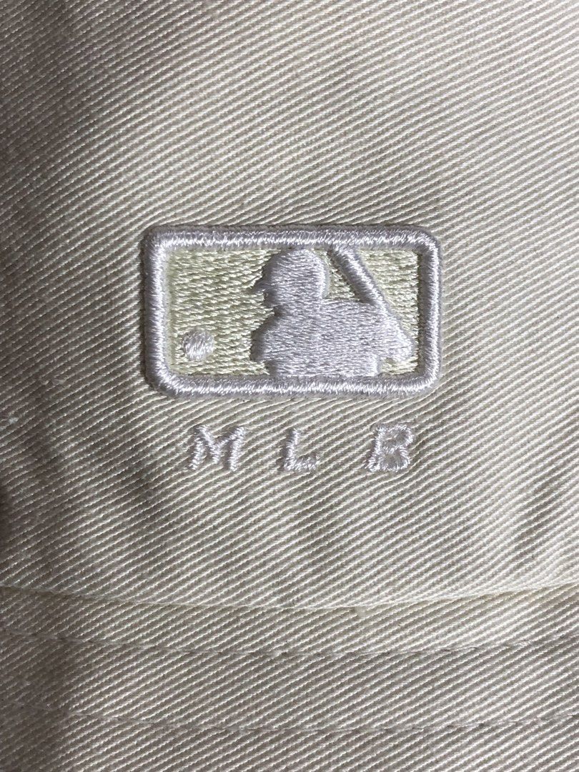 MLB Bucket Hat - Cream - Medium to Large (Category: Caps & Hats) located in Montevista. Submitted by rdthriftshub (Listing ID 1464655802, Image 3). Description: - Cream colored MLB bucket hat - Classic MLB logo embroidered on the front - Size 57 (fits Medium to Large) - Ideal for sunny days - Versatile and easy to style with any outfit.