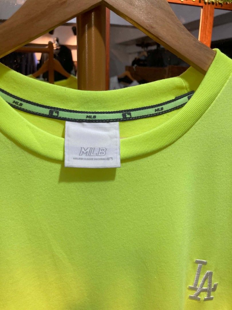 MLB LA Dodgers Neon Yellow T-Shirt (Category: Tshirts & Polo Shirts ) located in Trece Martires City. Submitted by djaothriftshop (Listing ID 1464706032, Image 3). Description: - Authentic MLB Los Angeles Dodgers neon yellow t-shirt - Embroidered team logo on the chest with a large reflective LA graphic on the back - Crew neck design with branded inner taping for added detail - Comfortable cotton and polyester blend fabric.