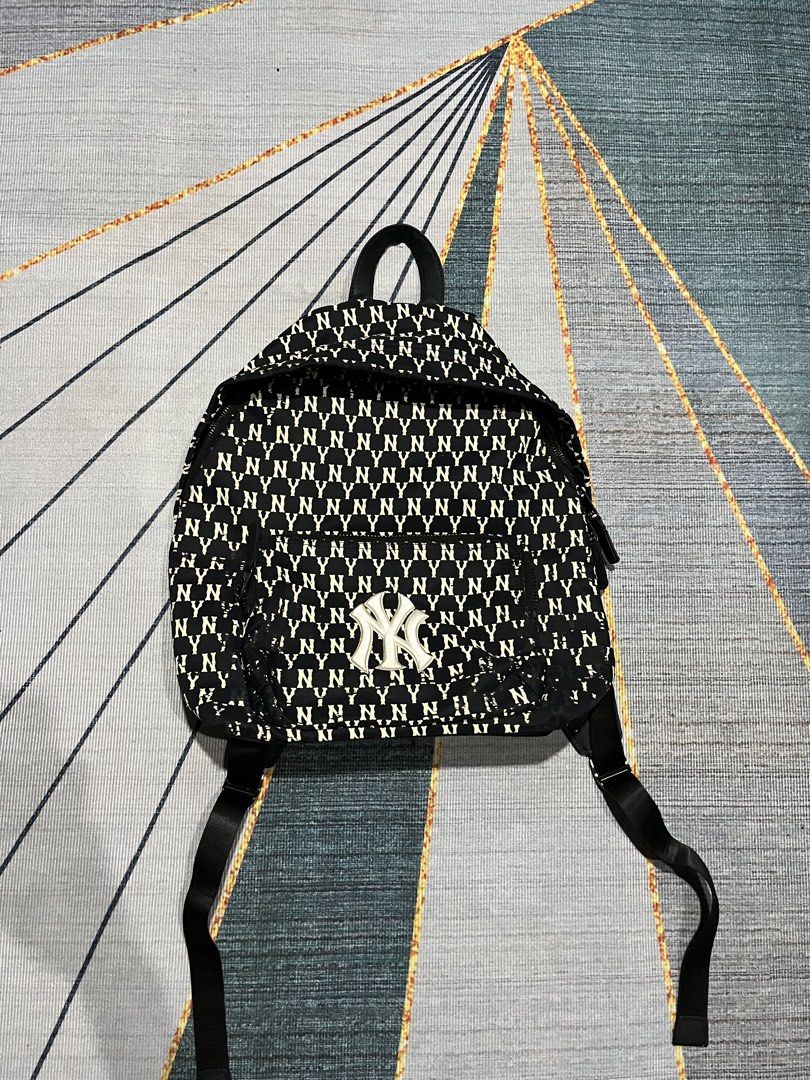 MLB New York Yankees All Over Print Mini Backpack (Category: Backpacks) located in Puerto Princesa. Submitted by dijaydj28 (Listing ID 1464590174, Image 1). Description: - Stylish black and white Yankees mini backpack - Features an all-over NY logo print - Main compartment for essentials - Additional small zippered pocket inside - Adjustable straps for a comfortable fit - Ideal for everyday use or quick outings.