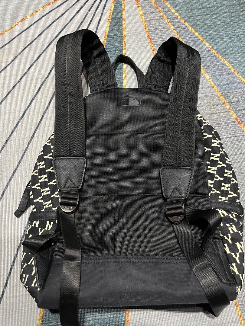 MLB New York Yankees All Over Print Mini Backpack (Category: Backpacks) located in Puerto Princesa. Submitted by dijaydj28 (Listing ID 1464590174, Image 2). Description: - Stylish black and white Yankees mini backpack - Features an all-over NY logo print - Main compartment for essentials - Additional small zippered pocket inside - Adjustable straps for a comfortable fit - Ideal for everyday use or quick outings.