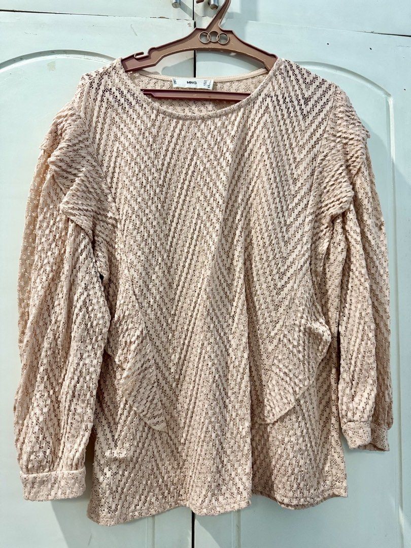 MNG Beige Crochet Long Sleeve Top (Category: Longsleeves) located in Manila. Submitted by melissaal82890 (Listing ID 1464587173, Image 1). Description: - Beige crochet top from MNG - Long sleeves with ruffled shoulder detail - Chevron pattern throughout - Perfect for layering or wearing solo - Ideal for casual or dressed-up occasions.