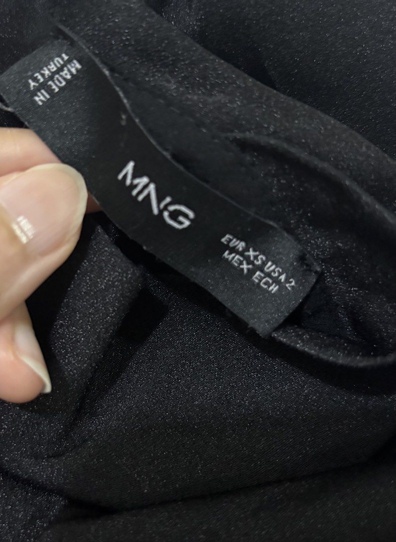 Mango Black Sleeveless Mock Neck Top (Category: Sleeveless) located in Makati City. Submitted by secondstory222 (Listing ID 1464570903, Image 3). Description: - Black sleeveless - Mock neck style - Satin-like material - Asymmetrical scarf mock neck .