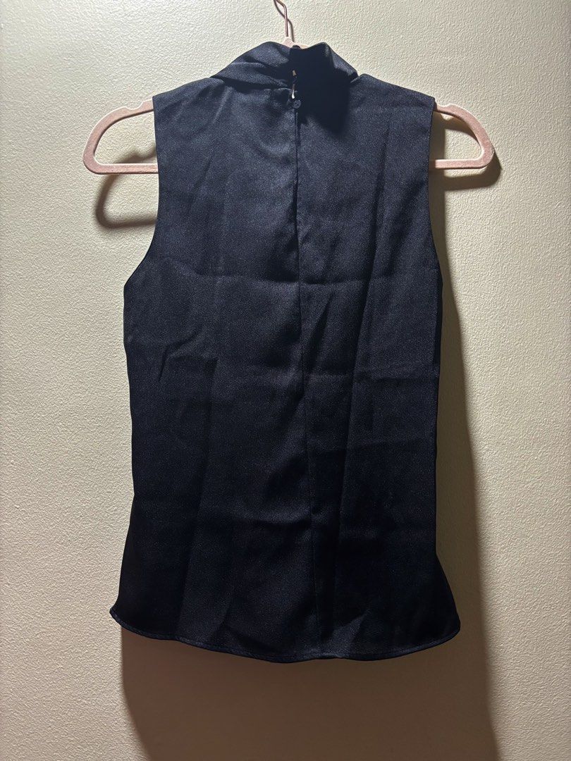 Mango Black Sleeveless Mock Neck Top (Category: Sleeveless) located in Makati City. Submitted by secondstory222 (Listing ID 1464570903, Image 2). Description: - Black sleeveless - Mock neck style - Satin-like material - Asymmetrical scarf mock neck .