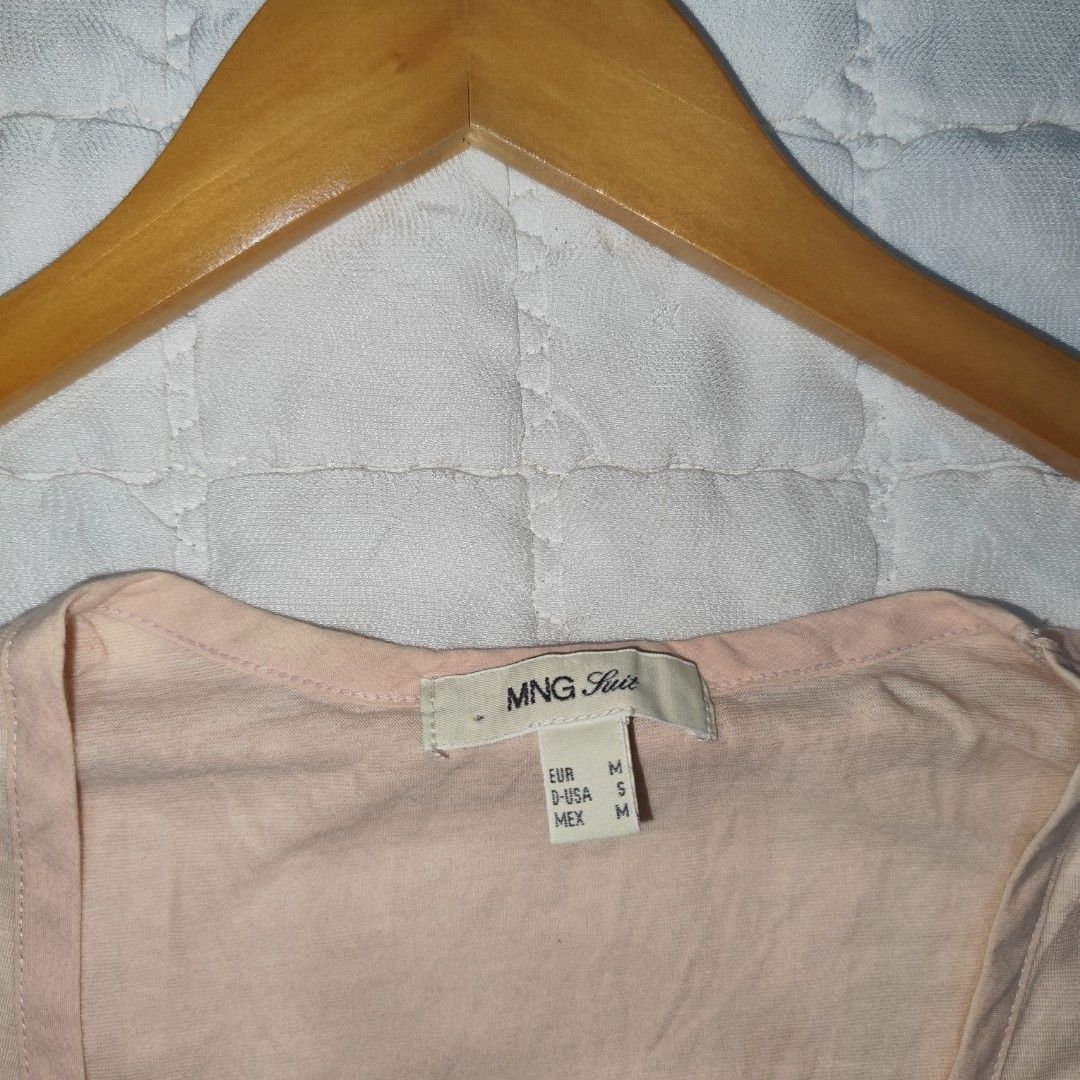 MNG Light Pink/Peach Wrap Peplum Top (Category: Blouses) located in Bacolod City. Submitted by dearicawho.56 (Listing ID 1464707955, Image 3). Description: - Color: Soft light pink/Peach - Size: Can fit Small - Med 🧾Mode of payment: 💙Gcash 💚GoTyme 🖤Maya 📍 Bacolod City. Negros Occidental .