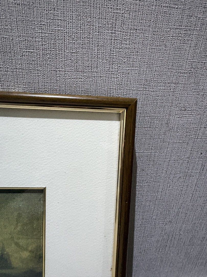Mona Lisa Framed Print (Category: Art & Prints) located in Manila. Submitted by foundhouseph (Listing ID 1464749454, Image 3). Description: - Classic Mona Lisa print featuring timeless Renaissance art - Size: 30x39cm - Elegant dark wood-finish frame with chic metallic inner trim - Neutral off-white matting for a sophisticated look - Ready to hang with an attached white hanging cord - Clean overall appearance with minimal wear on the hardware and 