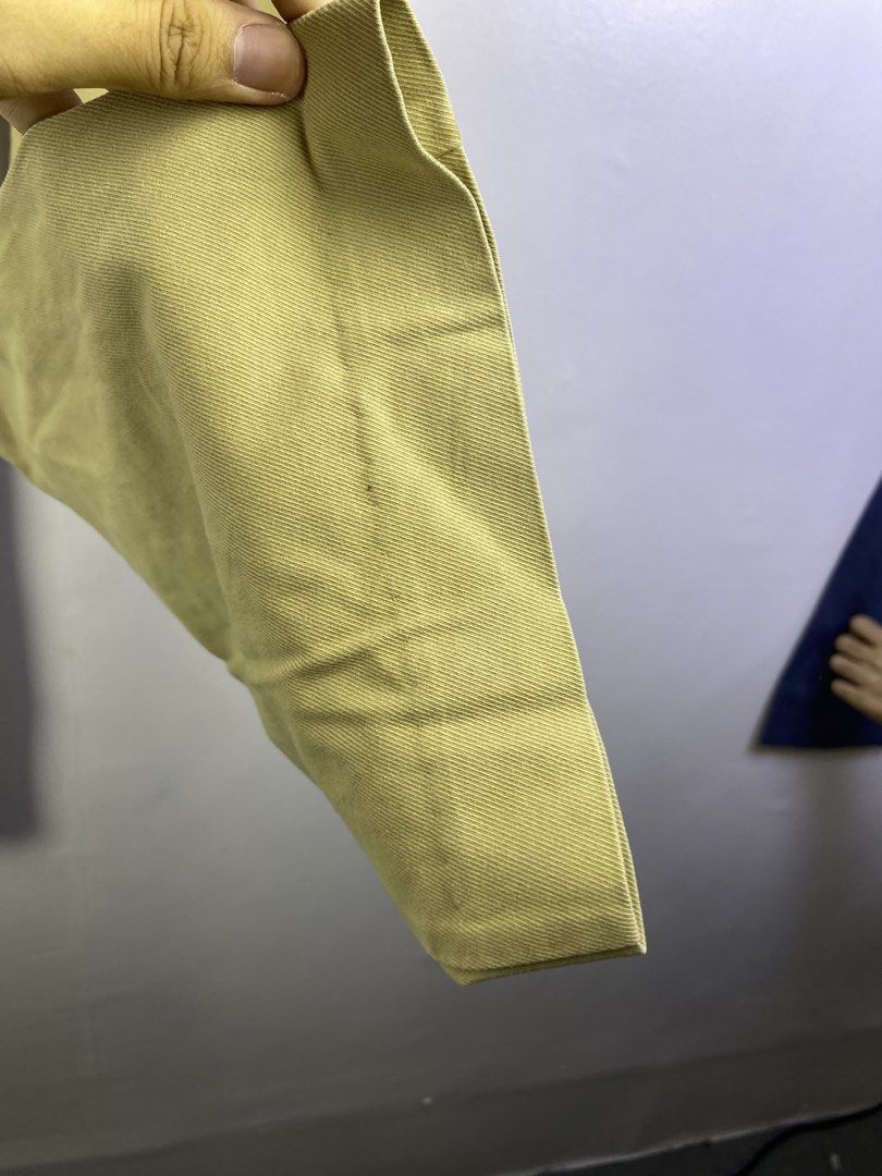 Moncler Khaki Bootcut Dress Pants (Category: Jeans) located in Manila. Submitted by declutterpromax (Listing ID 1464601130, Image 3). Description: - Classic khaki bootcut dress pants - Ideal for work or smart casual occasions - Features a fabric with a nice drape - Minor marks present, as shown in the last few photos.