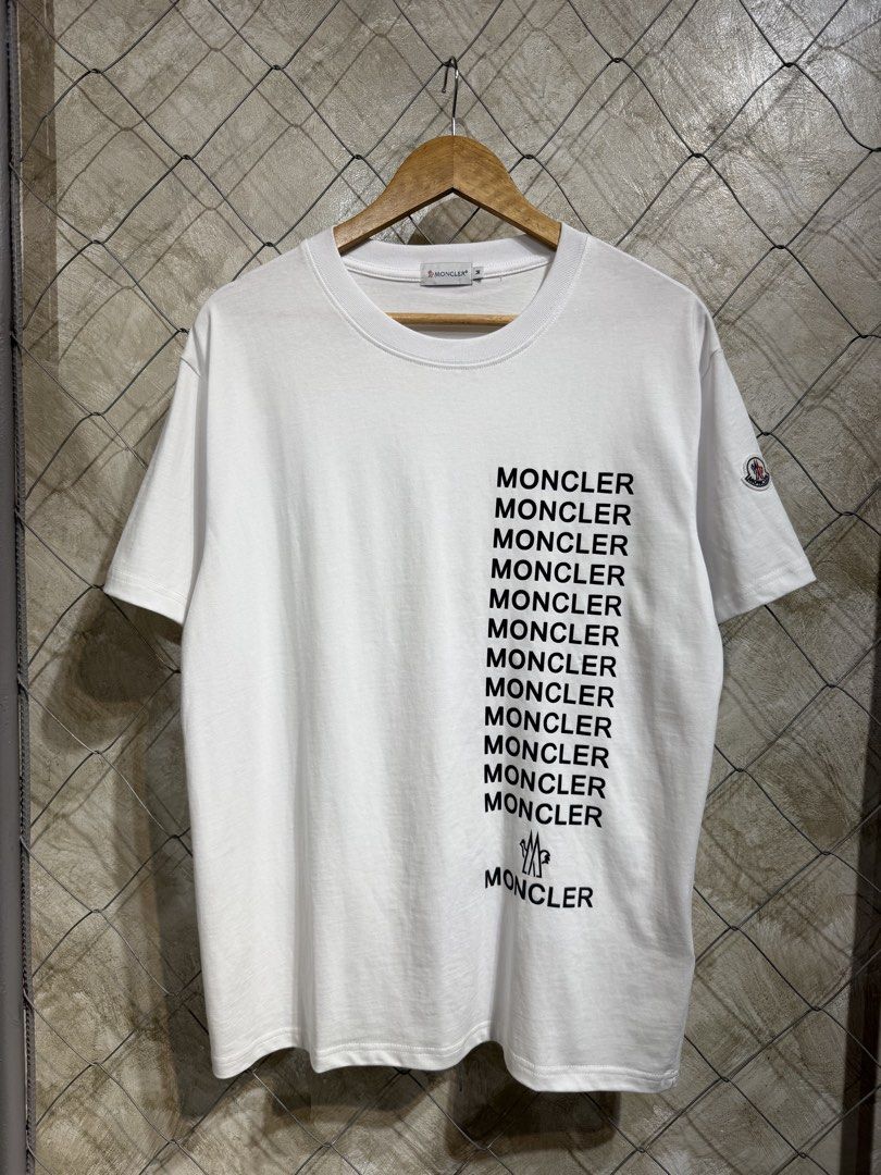 Moncler White Multiple Logo Print T-Shirt Size M (Category: Tshirts & Polo Shirts ) located in Manila. Submitted by ardobe.mnl (Listing ID 1464747519, Image 1). Description: Moncler Multiple Script Logo White Tee. Size: Large Dimes: 21x28 Condition: Excellent Flaw: None! Dm for inquiries!.