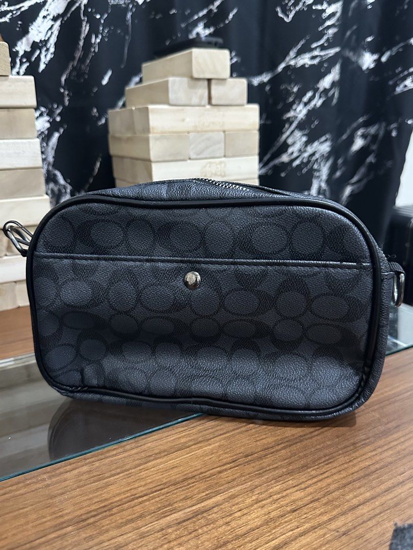 Monogram Pouch Bag (Category: Luxury Bags & Wallets) located in Baguio. Submitted by surplusbaguio.shop (Listing ID 1464622646, Image 2). Description: - Signature monogram pattern - Zipper closure - Front pocket with snap button - Interior compartments for organization - Ideal for keeping essentials tidy.