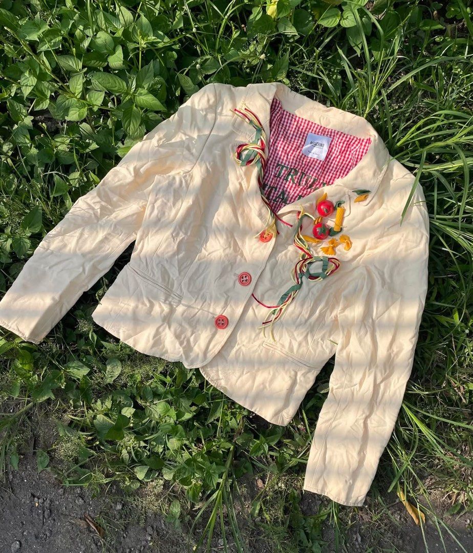 Moschino Cheap & Chic S/S 2006 Collection (Category: Coats, Jackets and Outerwear) located in Polomolok. Submitted by domingthriftclothes (Listing ID 1464688182, Image 1). Description: - Brand: Moschino Cheap and Chic (Made in Italy by Aeffe) - Size/Fit: Cream cotton and linen blend fabric - Design details: Playful pasta and tomato lapel embellishments with spaghetti ribbon trim - Lining: Red and white gingham print with 'TRULY ITALIAN' lettering
