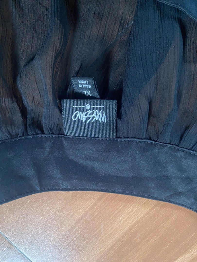 Mossimo Black Sheer Cap Sleeve Top XL (Category: Sleeveless) located in Manila. Submitted by reginemarquez412 (Listing ID 1464675557, Image 2). Description: - Brand: Mossimo - Color: Black - Style: Sheer top - Sleeves: Cap sleeves - Closure: Button closure at the back - Details: Satin trim around neckline and sleeves - Size: XL - Versatility: Great for layering or wearing on its own.
