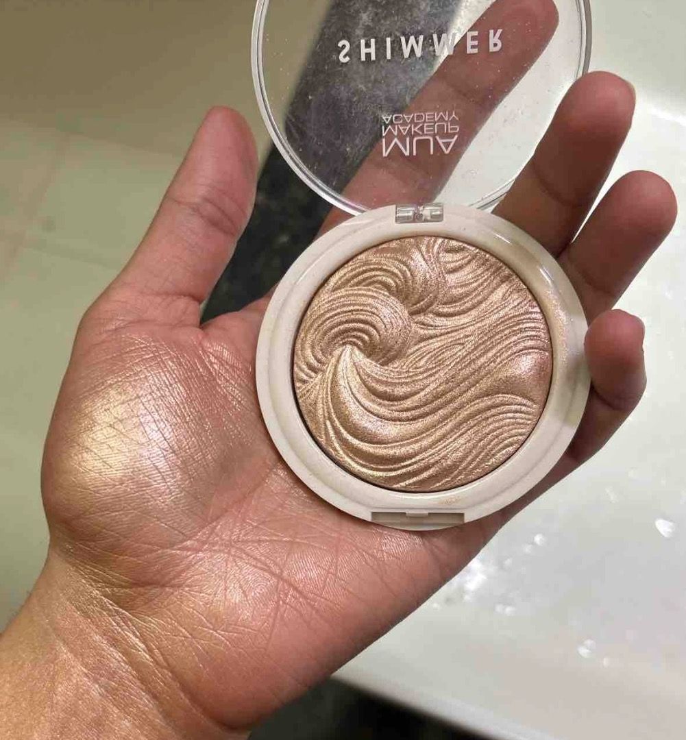 MUA Makeup Academy Shimmer Highlight Powder (Category: Makeup) located in Cebu City. Submitted by kyeshamori24 (Listing ID 1464720489, Image 2). Description: - Brand: MUA Makeup Academy - Product: Shimmer Highlight Powder - Price: ₱150 each - Formula: Swirled baked texture, super pigmented - Finish: Intense glow that catches the light - Available Shades: Iridescent Gold, Pink Shimmer - Best For: Cheekbones, brow bones, and collarbones.