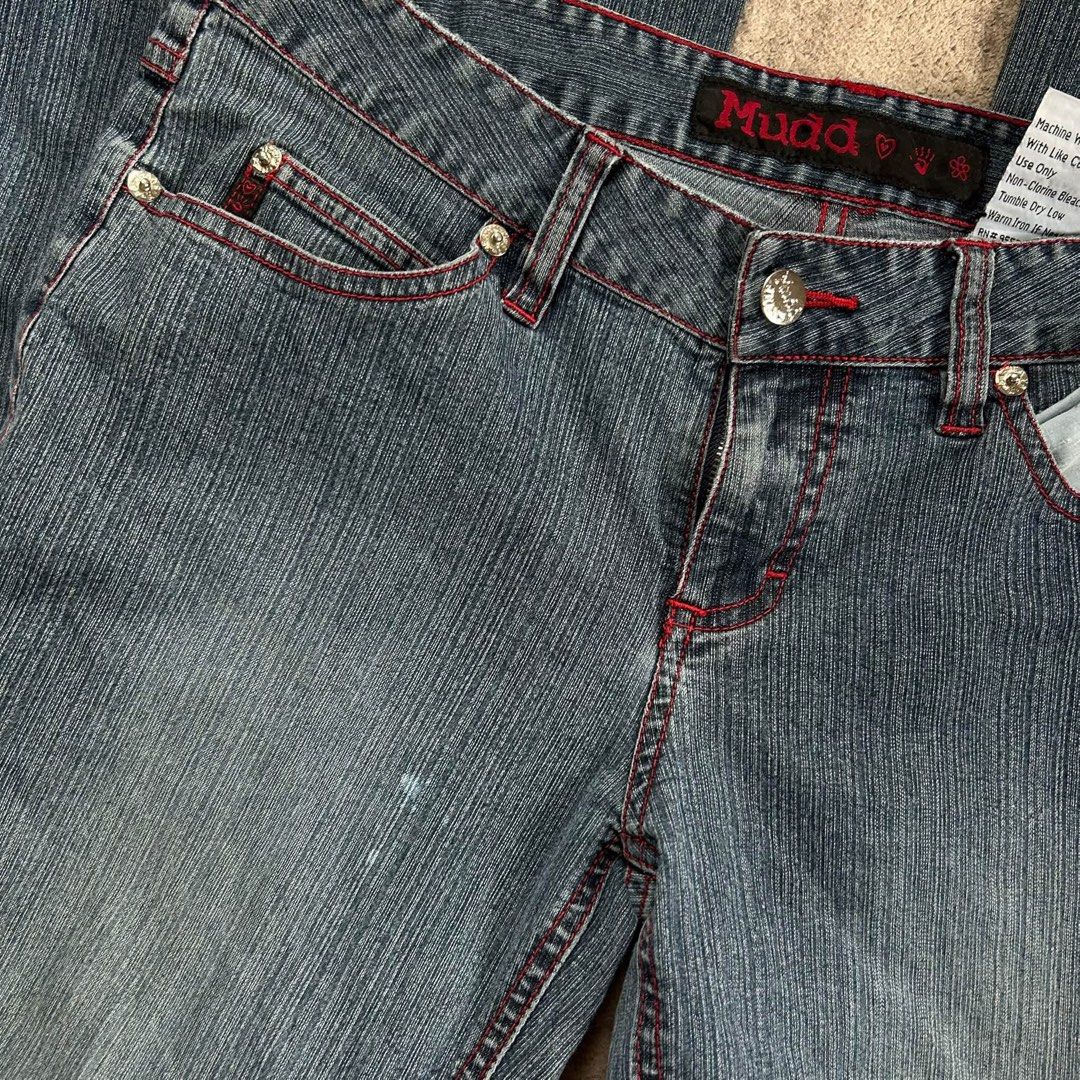 Mudd Flare Vntg y2k Jeans with Red Stitching (Category: Jeans) located in Davao. Submitted by read_my_abouts (Listing ID 1464590521, Image 3). Description: - Classic Mudd jeans waist: 28-30 inches length:41 inches laid flat - Flare leg style - Red contrast stitching throughout - Raw, distressed hem edge - Ideal for Y2K and retro outfits - Versatile for dressing up or down.