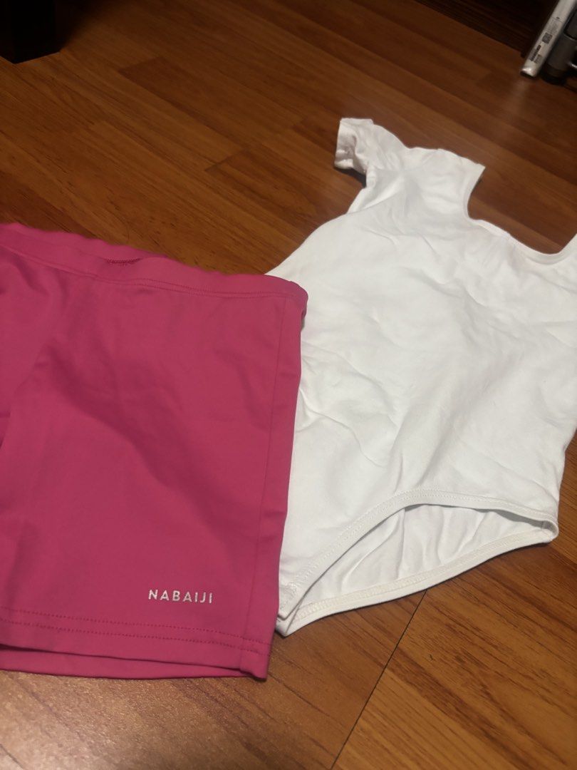 Nabaiji White Leotard & Pink Shorts Set (Category: Babies & Kids Fashion) located in Pasig City. Submitted by pipsqueakscorner (Listing ID 1464572047, Image 2). Description: - White short-sleeved leotard with scoop neck (back part) - Pink Nabaiji shorts with small logo detail - Ideal for dance or gymnastics practice - Made from comfortable and stretchy material - Perfect for active kids Sold in set RFS: Outgrown.