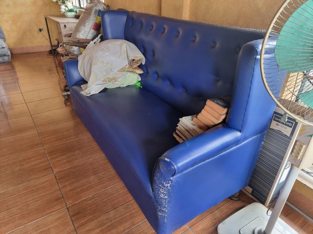 Nail Salon Blue Tufted 3-Seater Sofa (Category: Sofas) located in Quezon City. Submitted by rl_minimalist (Listing ID 1464615990, Image 3). Description: - Vibrant blue two-seater sofa - Features a stylish tufted backrest - High arms for added comfort and style - Ideal for living rooms or lounge areas - Ready for a new home!.