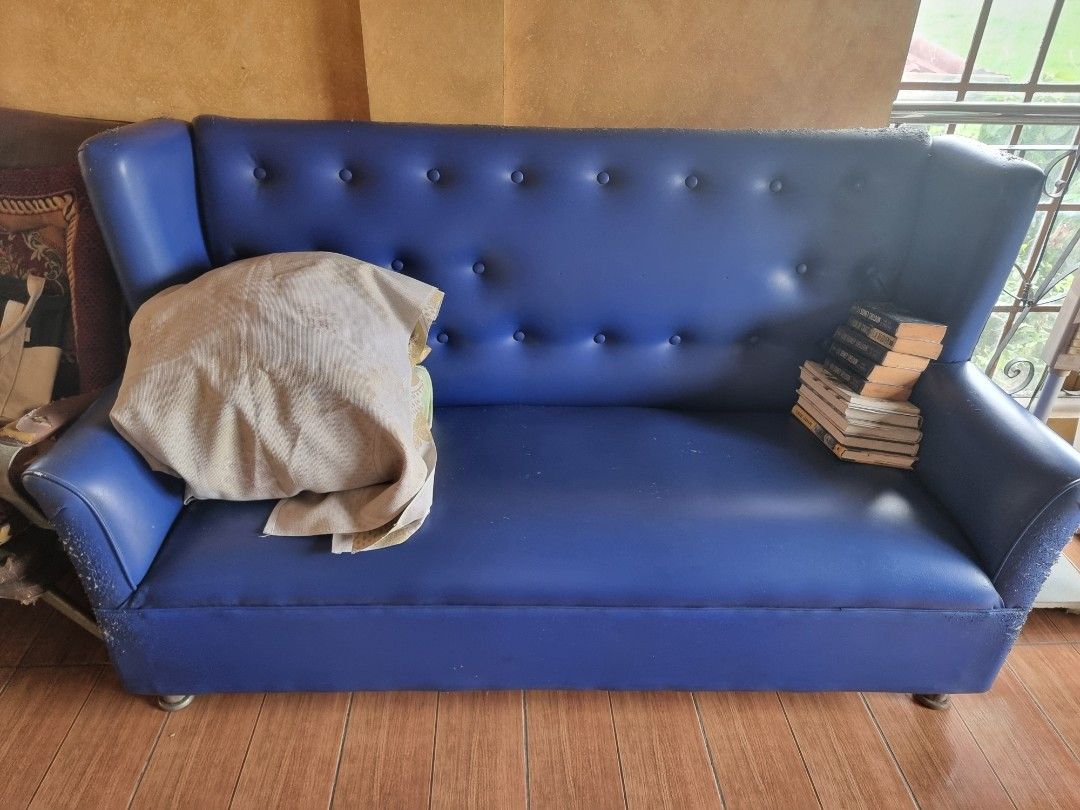 Nail Salon Blue Tufted 3-Seater Sofa (Category: Sofas) located in Quezon City. Submitted by rl_minimalist (Listing ID 1464615990, Image 2). Description: - Vibrant blue two-seater sofa - Features a stylish tufted backrest - High arms for added comfort and style - Ideal for living rooms or lounge areas - Ready for a new home!.