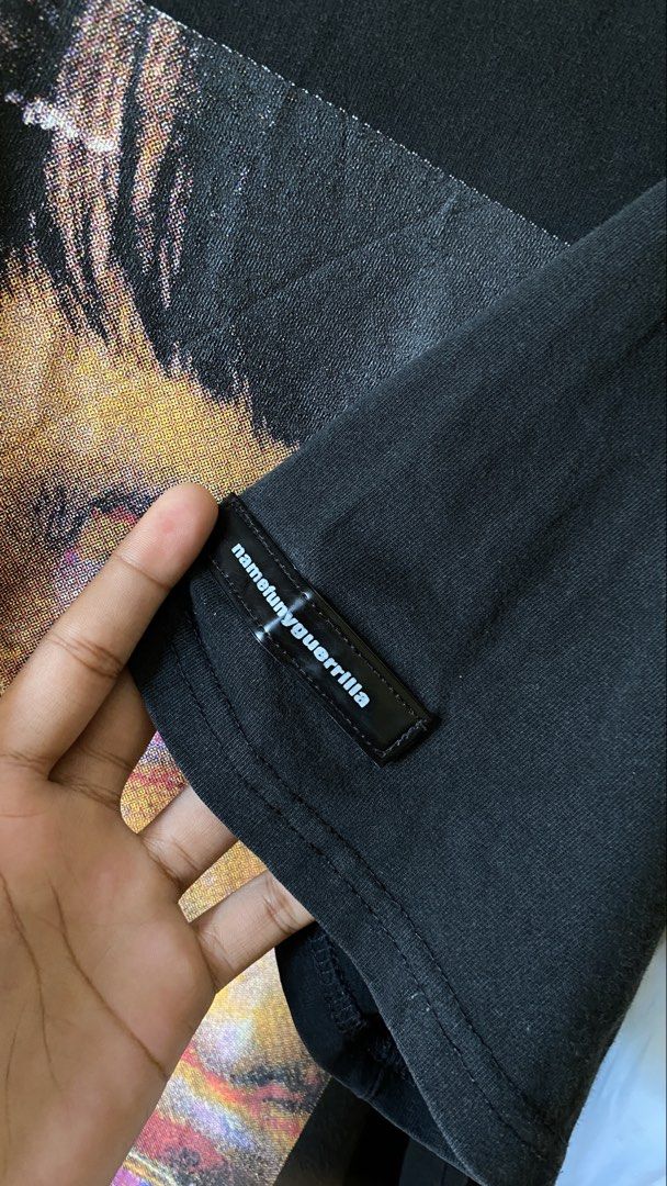 Namefunnyguerilla Rap Tee (Category: Tshirts & Polo Shirts ) located in Tacurong. Submitted by styledtwice1999 (Listing ID 1464605168, Image 3). Description: 🔥NameFunnyGuerilla Rap tee Color rate : 9 Print condition : 💎💎💎 issue: Small pinhole on Neck tag. ( see the last picture fellas ♥️.
