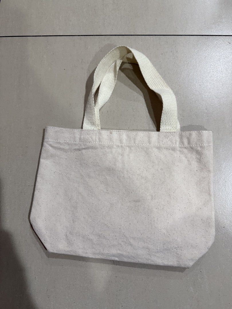 Natsu Panda Canvas Tote Bag (Category: Tote Bags) located in Manila. Submitted by metrosen (Listing ID 1464582628, Image 2). Description: - Adorable Natsu Panda design (sunglasses & float!) - Natural canvas color - Two sturdy handles - Ideal for small items, groceries, or daily essentials - Simple and fun casual bag.