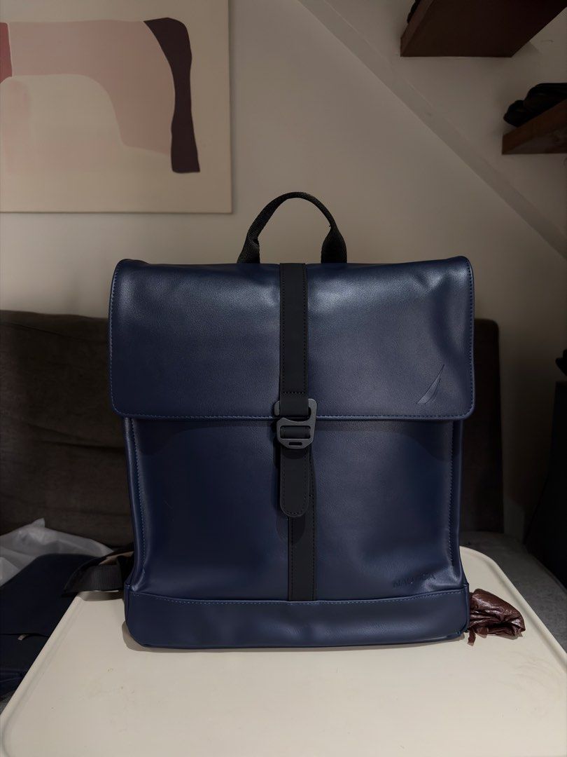 Nautica Navy Blue Leather Backpack (Category: Backpacks) located in Quezon City. Submitted by r_decluttering (Listing ID 1464594021, Image 1). Description: Nautica Leather Backpack Dark Blue With Laptop Sleeve Great for office or casual use Brand new, no issues. Rfs: Gift Height - 14.5 in. Length - 12.5 in. Width (at base) - 5 in..