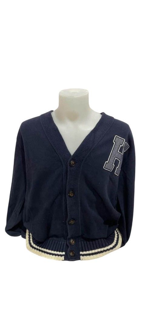 Navy Blue Varsity Cardigan with Letter Patch (Category: Coats, Jackets and Outerwear) located in Manila. Submitted by fidodido011 (Listing ID 1464769813, Image 1). Description: - Dark blue knit cardigan with a classic college jacket style - V-neckline with a button-up front closure - Large embroidered letter patch on the left chest - Ribbed hem and cuffs detailed with white and black stripes - Comfortable and versatile for everyday wear.