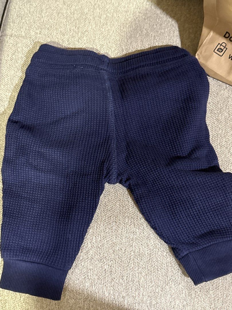 Navy Blue Waffle Knit Jogger Pants with Drawstring (Category: Babies & Kids Fashion) located in Cebu City. Submitted by jillianmariebascones (Listing ID 1464694627, Image 3). Description: - Color: Navy blue - Material: Soft textured waffle knit fabric - Fit: Comfortable pull-on style with elastic waistband - Details: Cute decorative polka dot drawstring - Cuffs: Ribbed ankles for a snug fit - Environment: Comes from a clean, smoke-free home Can f