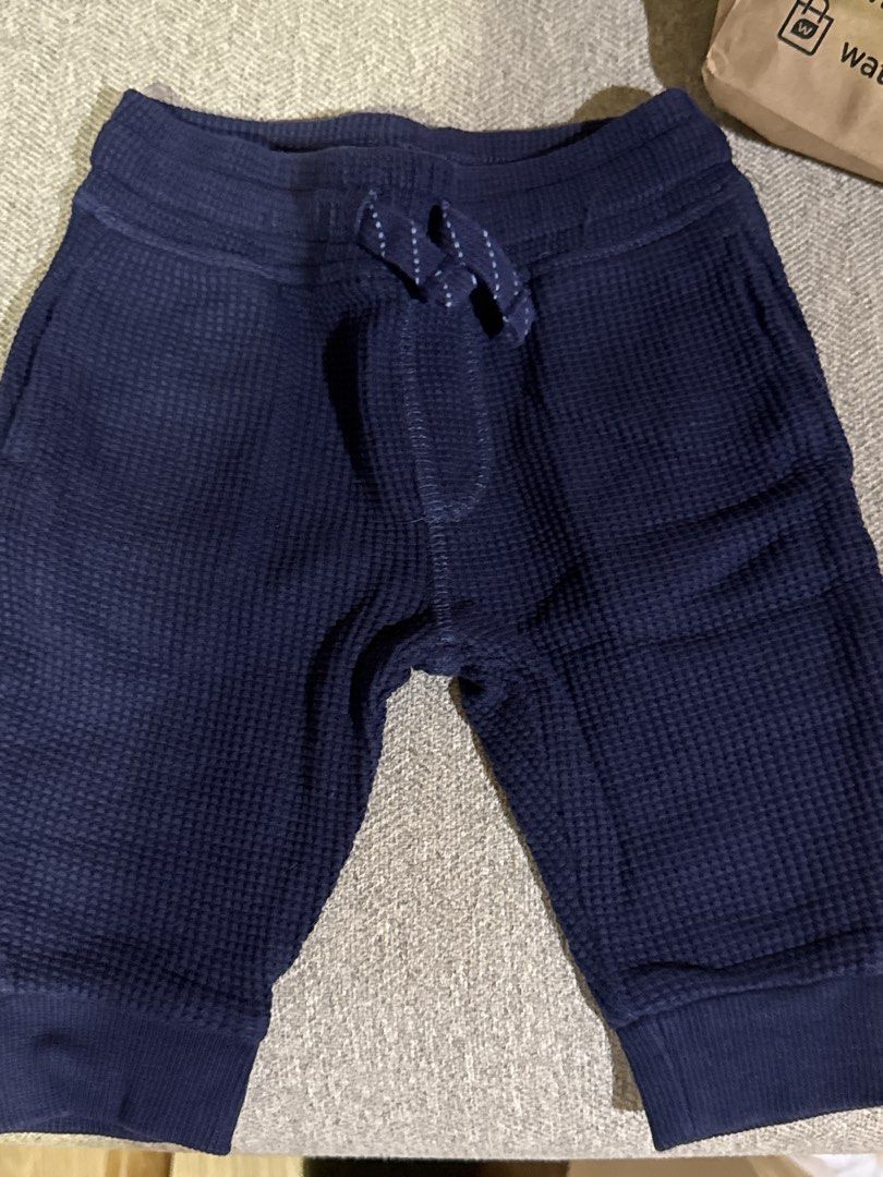 Navy Blue Waffle Knit Jogger Pants with Drawstring (Category: Babies & Kids Fashion) located in Cebu City. Submitted by jillianmariebascones (Listing ID 1464694627, Image 1). Description: - Color: Navy blue - Material: Soft textured waffle knit fabric - Fit: Comfortable pull-on style with elastic waistband - Details: Cute decorative polka dot drawstring - Cuffs: Ribbed ankles for a snug fit - Environment: Comes from a clean, smoke-free home Can f